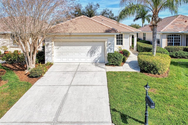 view of front facade featuring a front lawn and a garage