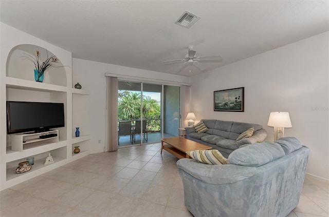 tiled living room featuring ceiling fan and built in features