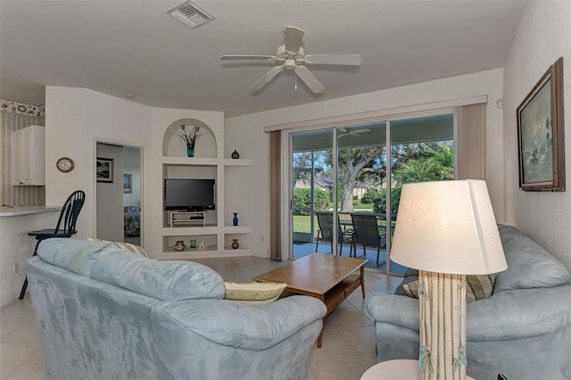 living room featuring ceiling fan and light tile patterned floors