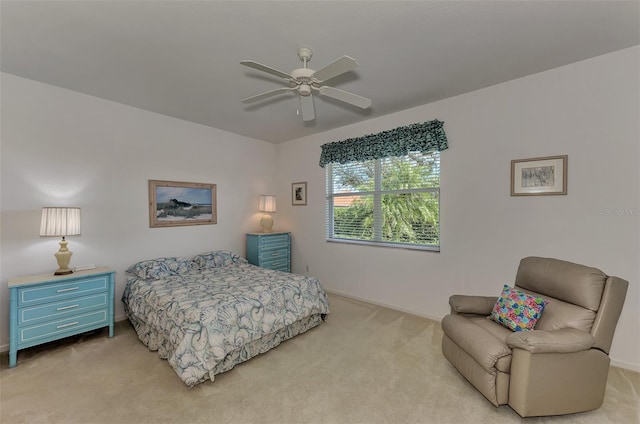 bedroom featuring ceiling fan and light colored carpet