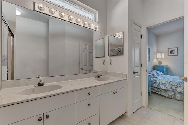 bathroom with vanity, tile patterned flooring, and an enclosed shower