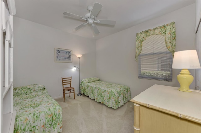 bedroom with light colored carpet and ceiling fan