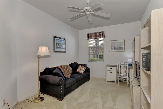 living room featuring light carpet and ceiling fan