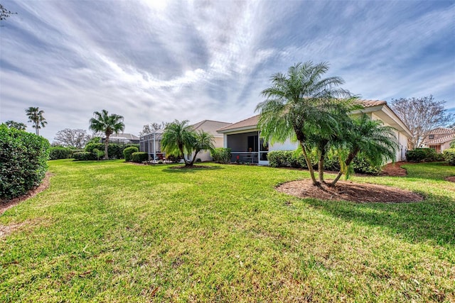 view of yard with a lanai