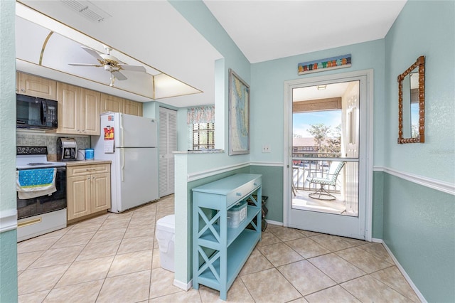404 Pine Hollow Cir Unit 404, Englewood, FL 34223 - kitchen featuring white appliances, light tile patterned floors, a ceiling fan, light countertops, and baseboards