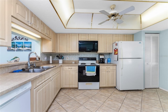 kitchen featuring decorative backsplash, ceiling fan, light brown cabinetry, sink, and white appliances