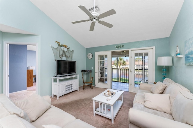 living room featuring french doors, ceiling fan, vaulted ceiling, and light colored carpet