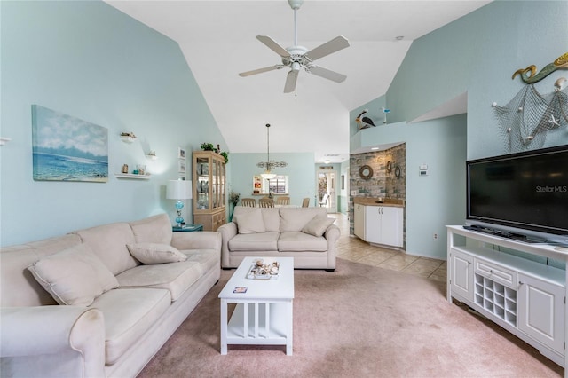 404 Pine Hollow Cir Unit 404, Englewood, FL 34223 - living area featuring high vaulted ceiling, a ceiling fan, and light colored carpet