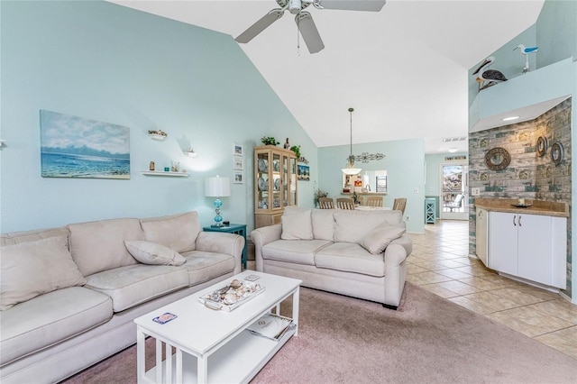 tiled living room with high vaulted ceiling and ceiling fan