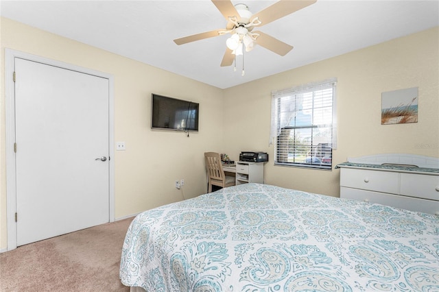 carpeted bedroom featuring a closet and ceiling fan