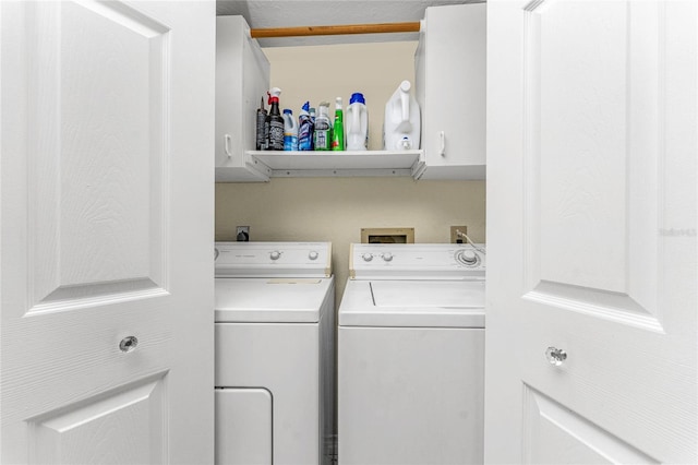404 Pine Hollow Cir Unit 404, Englewood, FL 34223 - washroom with cabinet space and washer and clothes dryer