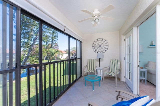 sunroom with french doors and ceiling fan