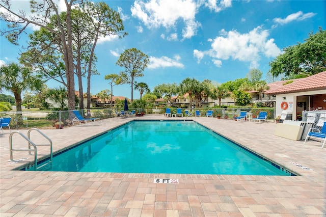 view of pool featuring a patio area