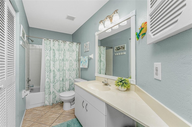 full bathroom featuring tile patterned floors, toilet, vanity, and shower / bath combo