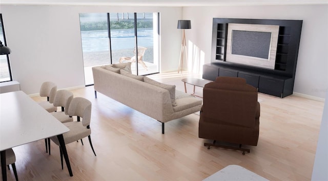 living area featuring baseboards and light wood-type flooring