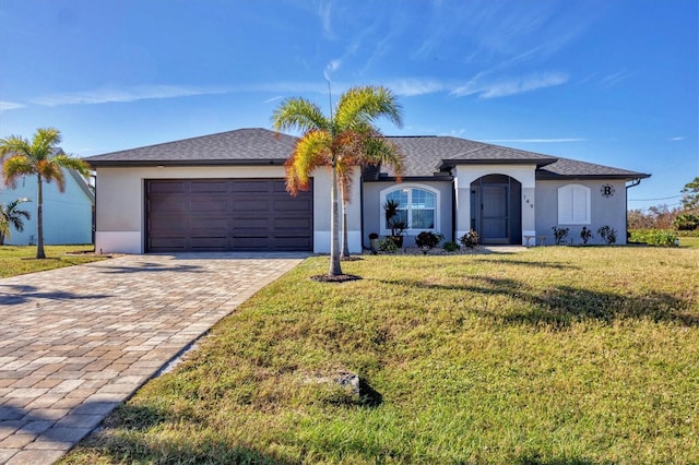 ranch-style home with a front yard and a garage