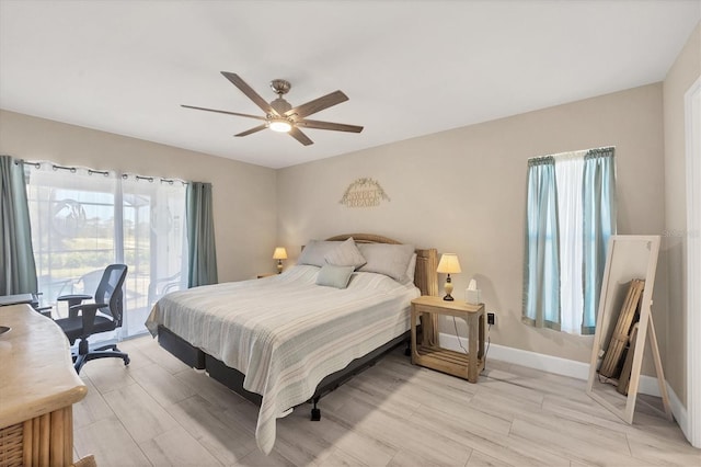 bedroom featuring light hardwood / wood-style flooring, access to outside, and ceiling fan