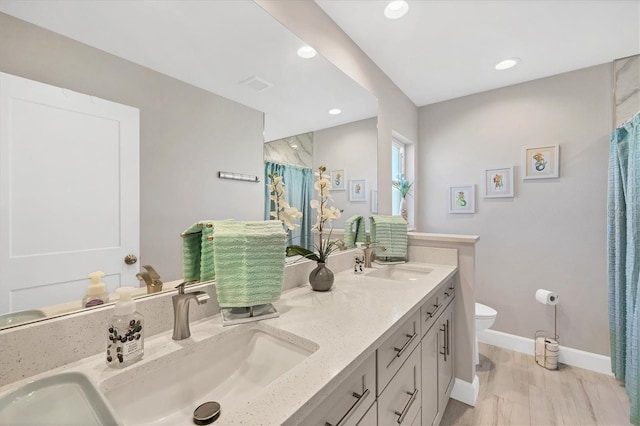 bathroom with vanity, hardwood / wood-style flooring, toilet, and a shower with curtain