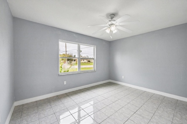 tiled empty room with ceiling fan