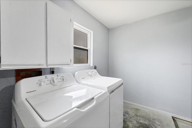 laundry room featuring cabinets and washing machine and dryer