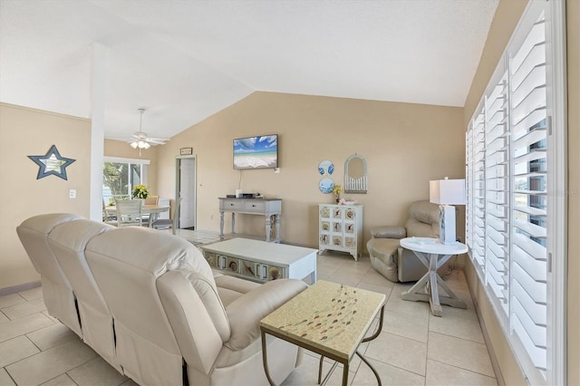 tiled living room with vaulted ceiling and ceiling fan