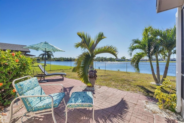 view of patio featuring a water view