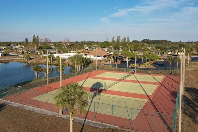 view of sport court with a water view