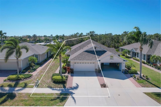 view of front of property featuring a garage, a carport, and a front yard