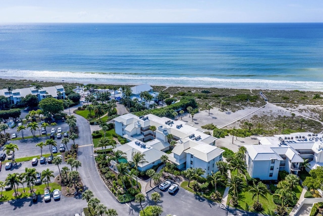 bird's eye view featuring a water view and a view of the beach