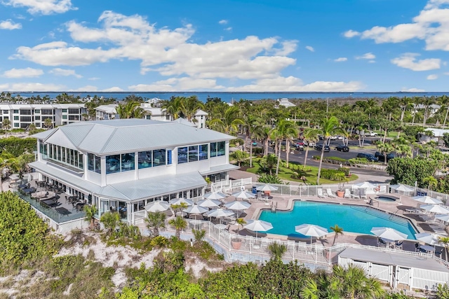 birds eye view of property with a water view