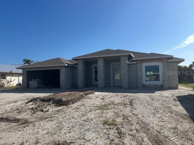 view of front of property with a garage