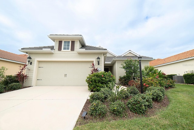 view of front of house featuring a front yard and a garage