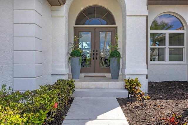 view of exterior entry featuring french doors