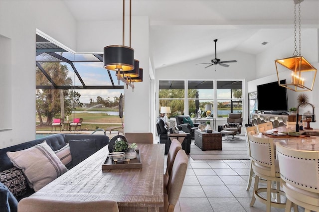 tiled dining area featuring ceiling fan, high vaulted ceiling, and a wealth of natural light