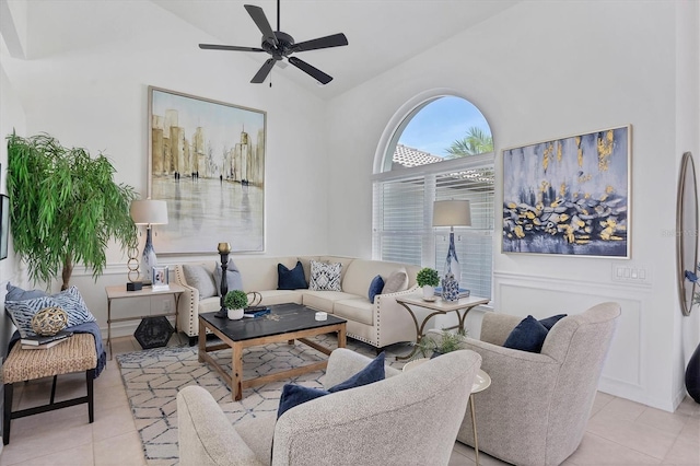 living room featuring light tile patterned floors, high vaulted ceiling, and ceiling fan