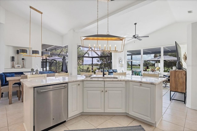 kitchen with sink, white cabinetry, decorative light fixtures, stainless steel dishwasher, and light stone countertops