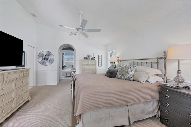 carpeted bedroom featuring vaulted ceiling and ceiling fan