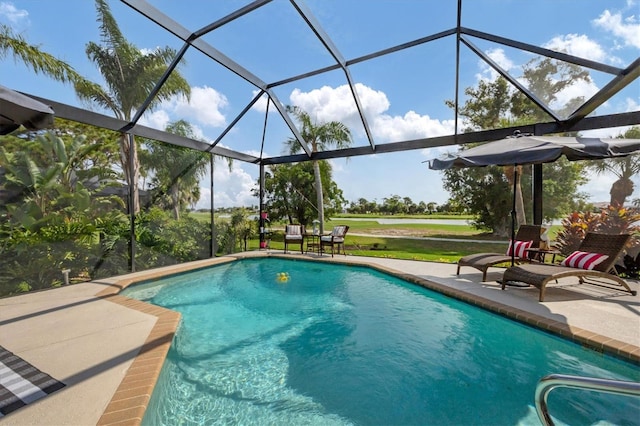 view of pool with a lanai and a patio area