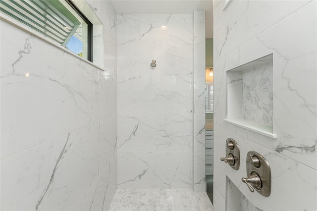 bathroom featuring tiled shower