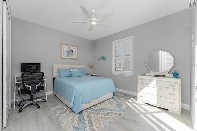 bedroom featuring light hardwood / wood-style flooring and ceiling fan