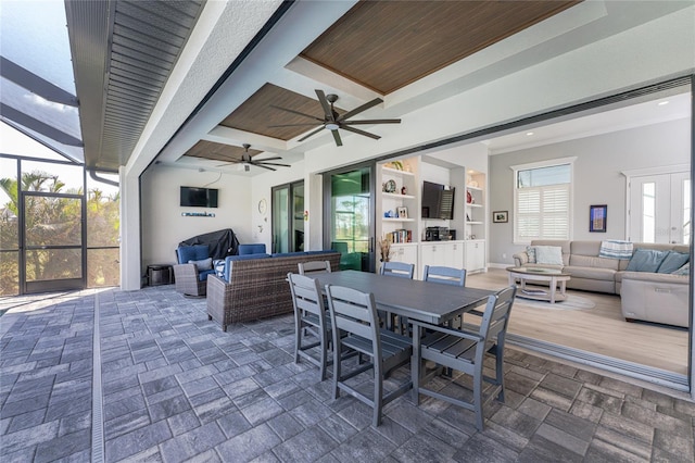 view of patio / terrace with outdoor lounge area, a lanai, and ceiling fan