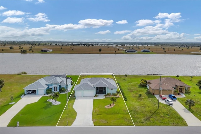 bird's eye view featuring a water view and a rural view