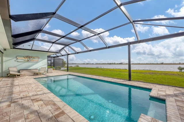 view of swimming pool with a patio area, a lawn, a water view, and glass enclosure