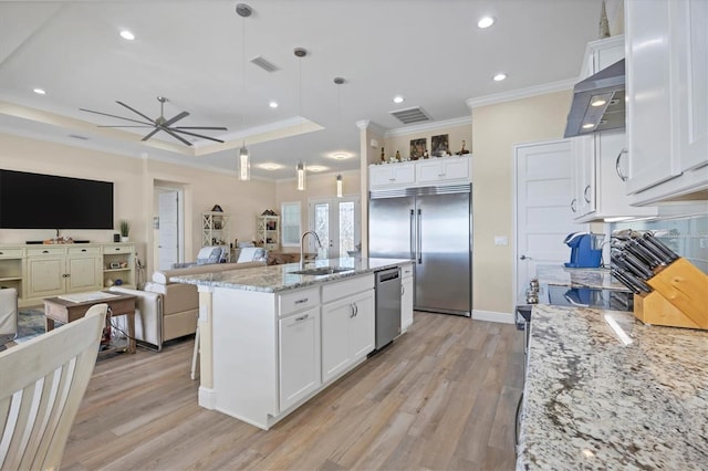 kitchen featuring white cabinetry, sink, light wood-type flooring, and stainless steel appliances