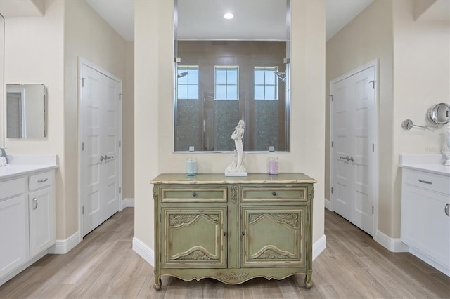 bathroom with vanity and hardwood / wood-style floors