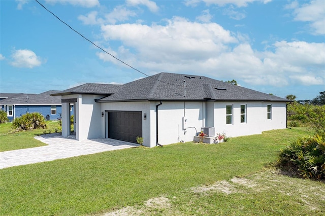 exterior space with a yard and a garage