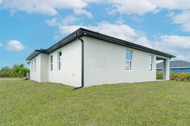 view of property exterior with a yard