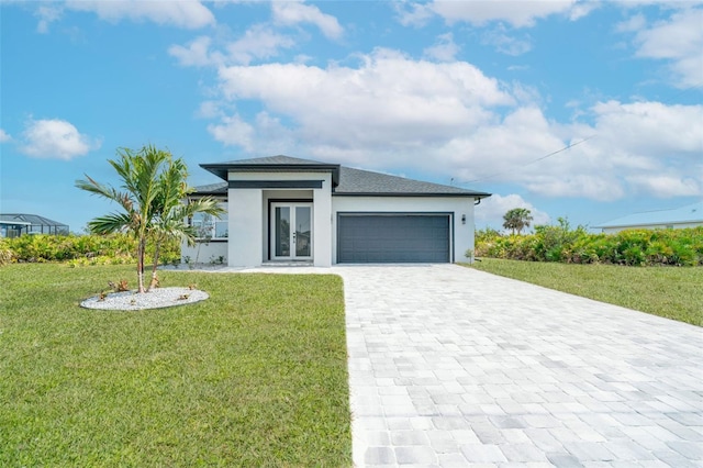 view of front of house with a garage and a front yard