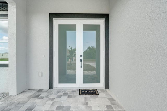 entrance to property featuring french doors