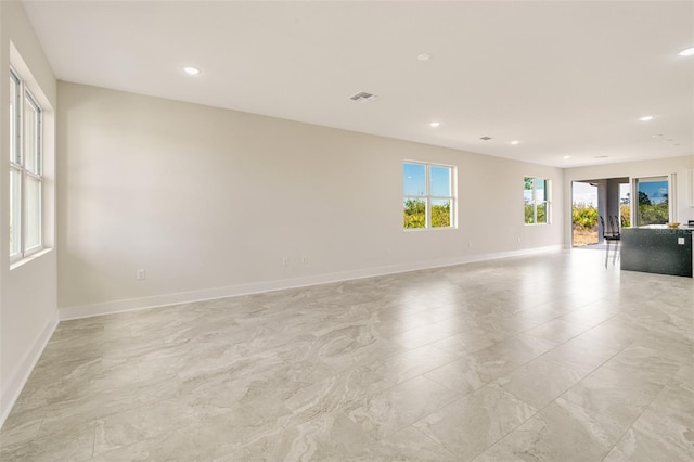 unfurnished room with french doors